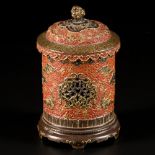 A porcelain incense burner with brown and brick red fond decorated with clouds among other things, m