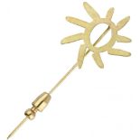 18K. Yellow gold Niessing sun lapel pin.