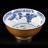 A porcelain bowl with capuchin exterior and floral decoration in the interior, marked with lozenger/