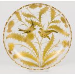 A glass bowl decorated with birds and plants in gilt.