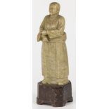 A soapstone sculpture of a farmer's wife with wheat in her hand, China, 2nd half 20th century.