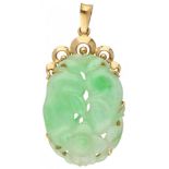 Pendant with carved jade in a 14K. yellow gold frame.