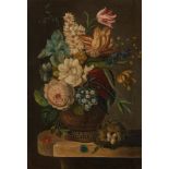 Bears signature "P.T. van Brussel", A still life with flowers on a marble plinth.
