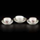 A lot comprised of (2+1) porcelain cups and saucers with famille rose decor, China, 18th century.