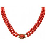 Two-row red coral necklace with a 14K. yellow gold closure.