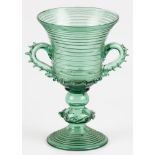 A green glass goblet, mouth blown.