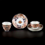 A set of (3) porcelain cups and saucers with Imari decoration, Japan, 18th century.