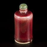 A porcelain sang de boeuf snuff bottle, China, 19th century.