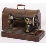 A cast iron Singer sewing machine in wooden casing, 20th century.