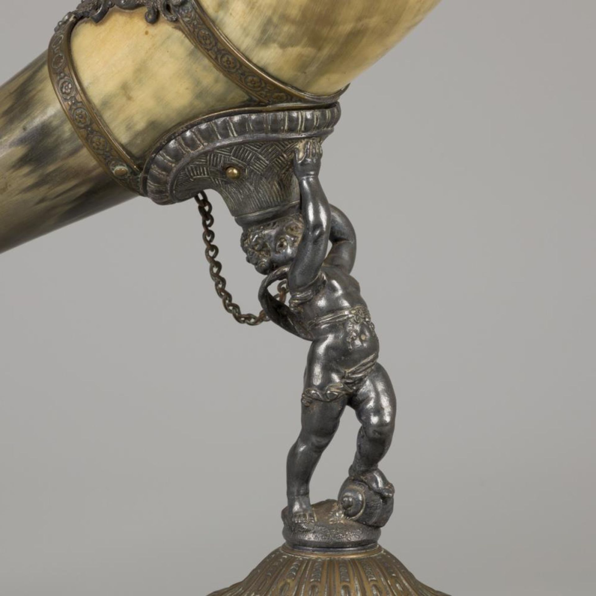 A drinking horn made of an ox horn, carried by a putto, ca. 1920. - Image 3 of 4