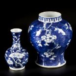 A lot comprising porcelain items a.w. a lidded vase and a pipe vase with Prunus decorations, China,