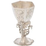 Miniature ornamental chalice on a silver base.