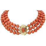 Three-row antique red coral necklace with a 14K. yellow gold openwork closure.