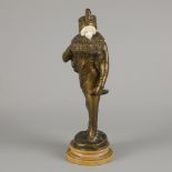 E. Thomasson (XIX-XX), A bronze sculpture of an elegant lady with a fur muff, Belgium, ca. 1900.