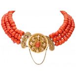 Three-row antique red coral necklace with a richly decorated 14K. yellow gold openwork filigree clos