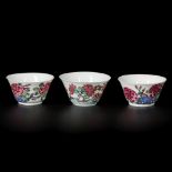 A lot comprising (3) porcelain famille rose cups with butterfly and bird decor, China, Yongzhen.