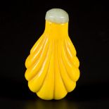 An imperial yellow glass snuff bottle, fruit-shaped, China, 19th century.