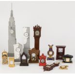 A lot consisting of miniature clocks in the shape of a standing watch and pendulums, among others. F