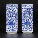 A set of (2) porcelain cylinder vases with dragon decoration, marked Kangxi, China, 19th century.