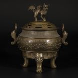 A bronze incense burner decorated with Chinese characters, China, 19th century.