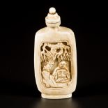 An ivory snuff bottle decorated with figures, China, 19th century.