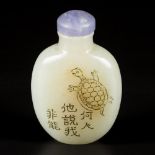 A Hetian jade snuff bottle decorated with a tortoise, China, 19th century.