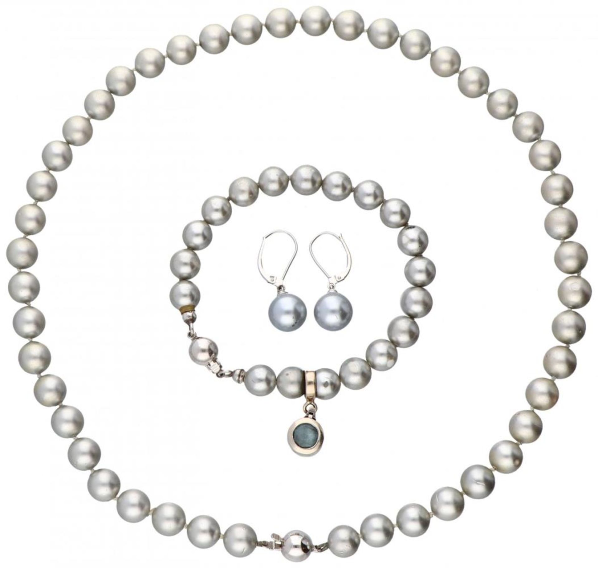 Set of pearl necklace, bracelet and earrings with 14K. white gold closures and pendant.