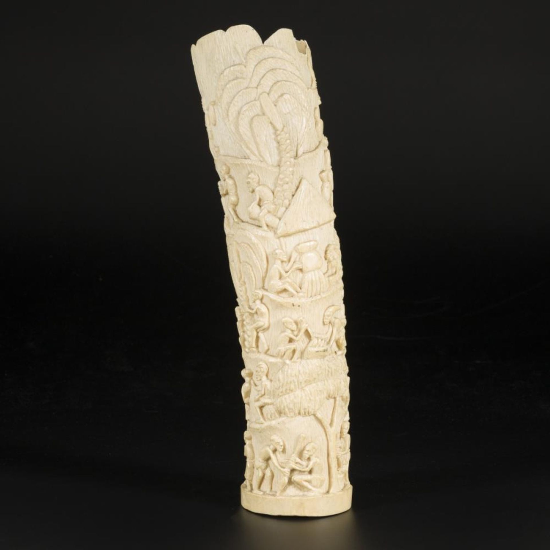 An ivory carving with depictions of African villagers, DRC, ca. 1920/30.