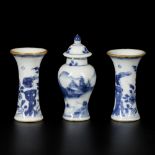 A (3)-piece porcelain garniture set (lidded vase and two beaker vases), China, 18th century.