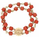14K. Yellow gold two-row bracelet with red beads.