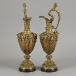 A pair of bronze claret jugs with cast bronze mounts, ca. 1900.