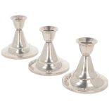 (3) piece set of candlesticks silver.