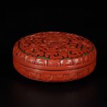 A lidded box in red lacquer, China, 20th century.