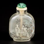 A glass snuff bottle with decoration of figures and a mountain landscape, China, 1st half 20th centu