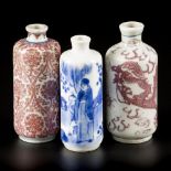 A lot comprised of (3) porcelain snuff bottles a.w. two with 'iron red' decor, China, 19th century.