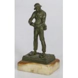 A bronze sculpture of a tradesman/ colporteur, France, 2nd quarter 20th century.