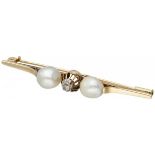 14K. Yellow gold brooch set with a rose cut diamond and freshwater pearls.