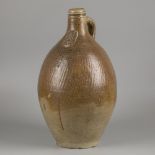 A bartmann/ 'Bartmann' stoneware jug with tiger salt glaze, (Cologne/ Frechen), Germany, ca. 1800.