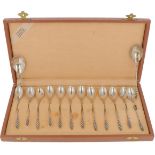 (14) piece set teaspoons with sugar scoop and silver tea thumb.