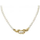 Single strand pearl necklace with an 18K. yellow gold closure and centerpiece.