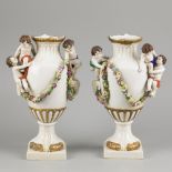 A set of (2) porcelain vases decorated with flowers, ram heads and children, Sitzendorf, late 19th c