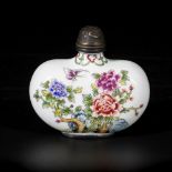 An enamel snuff bottle decorated with flowers, marked Qianglong, China, 20th century.