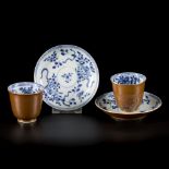 A set of (2) porcelain cups and saucers with floral decoration and capuchin exterior, China, 18th ce