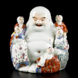 A porcelain Buddha with children, China, 1st half 20th century.