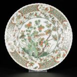 A porcelain plate with famille verte decor, China, 19th century.