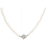 Freshwater pearl necklace with a 14K. white gold closure set with approx. 0.94 ct. diamond.