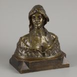 "S. Blanc". A bronze buste of a lady in traditional dress, 1st half 20th century.