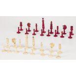 A bone partially coloured chess set.