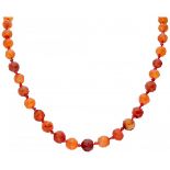 Single strand carnelian necklace with a 14K. yellow gold closure.