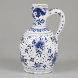 An earthenware jug with floral decor, Delft, 18th century.